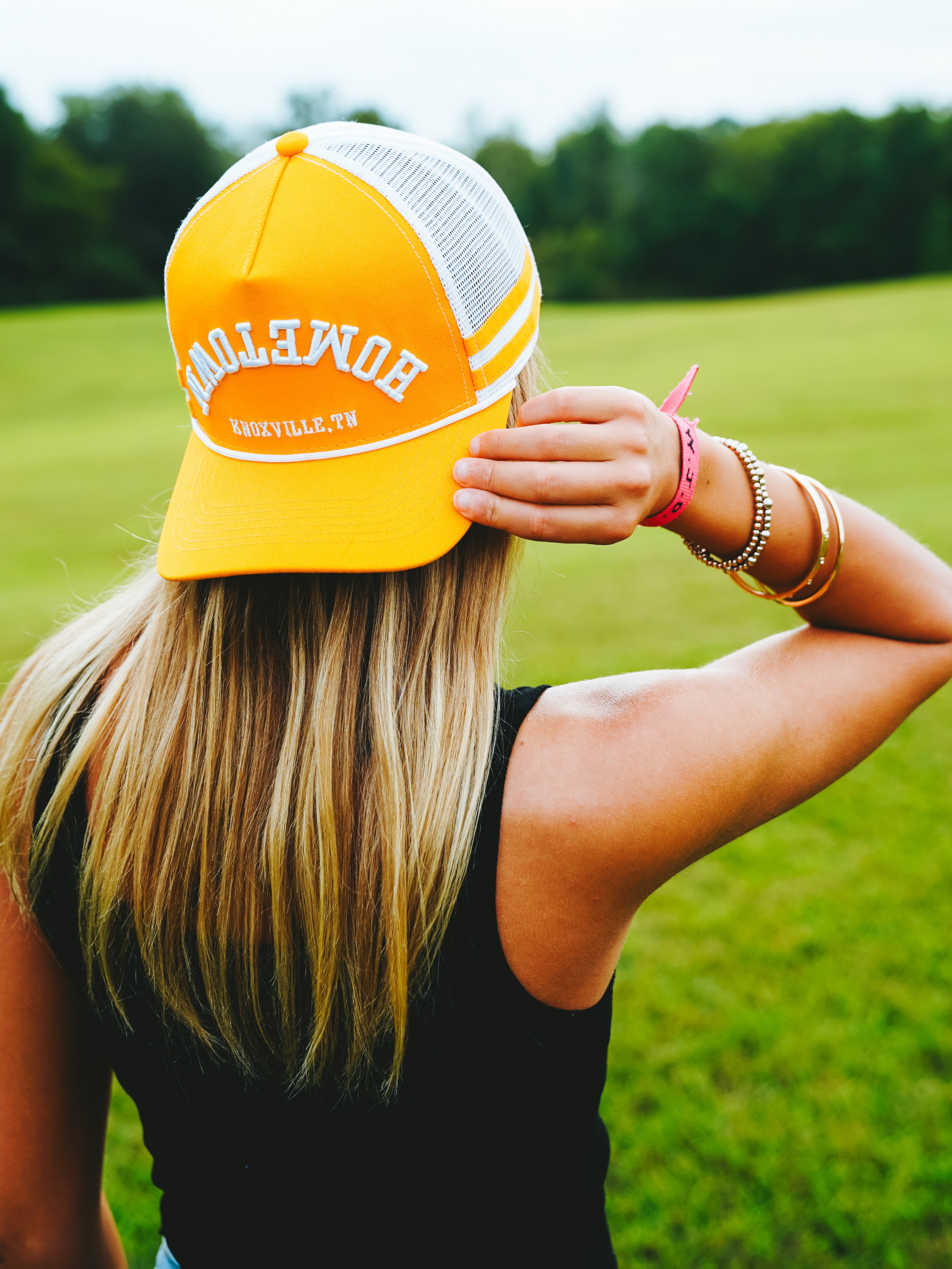 Upside Down Hometown Knoxville Hat in orange and white, trucker style cap.