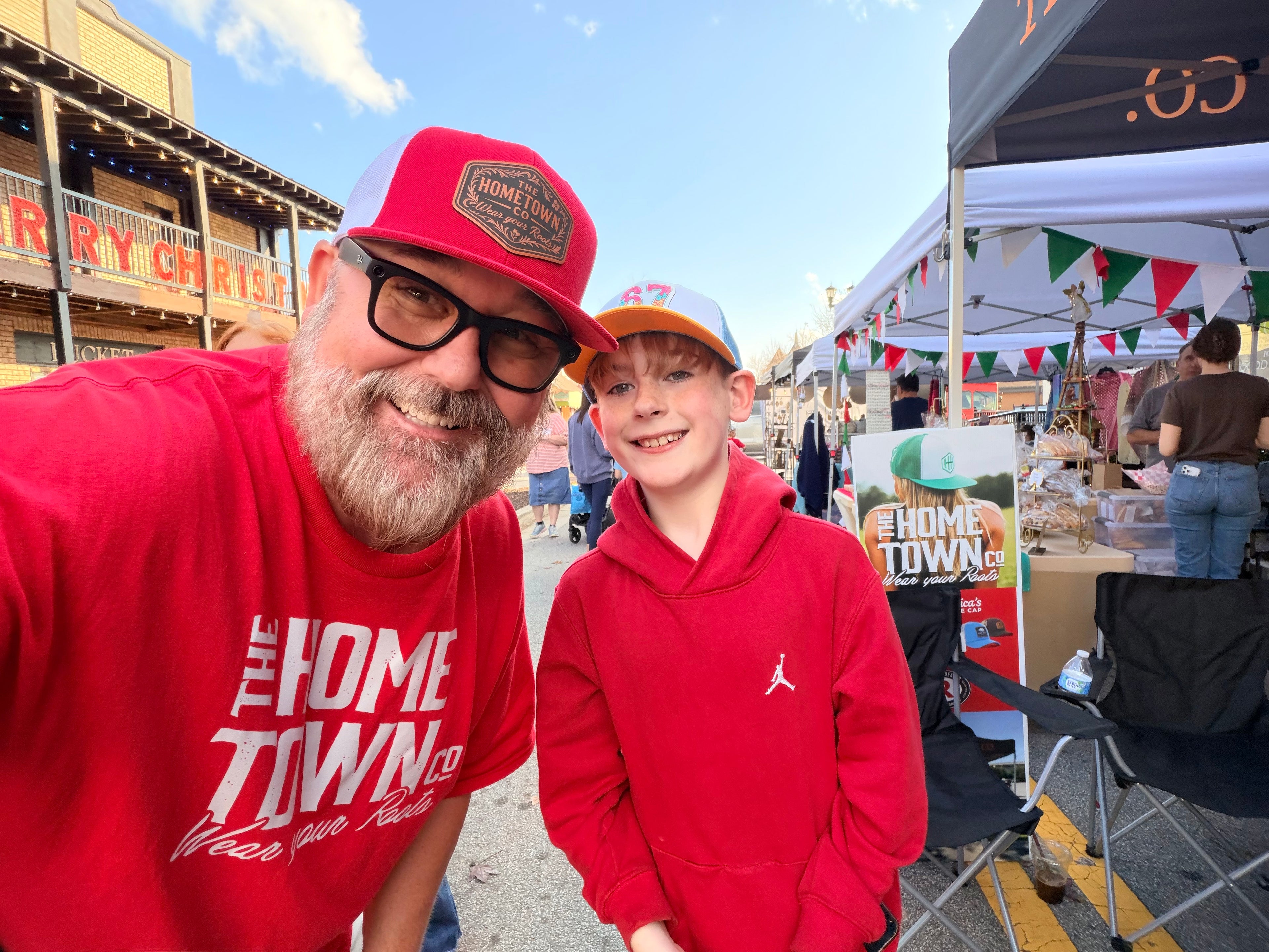67 Drip Trucker Hat in black with white embroidered logo on front panel.