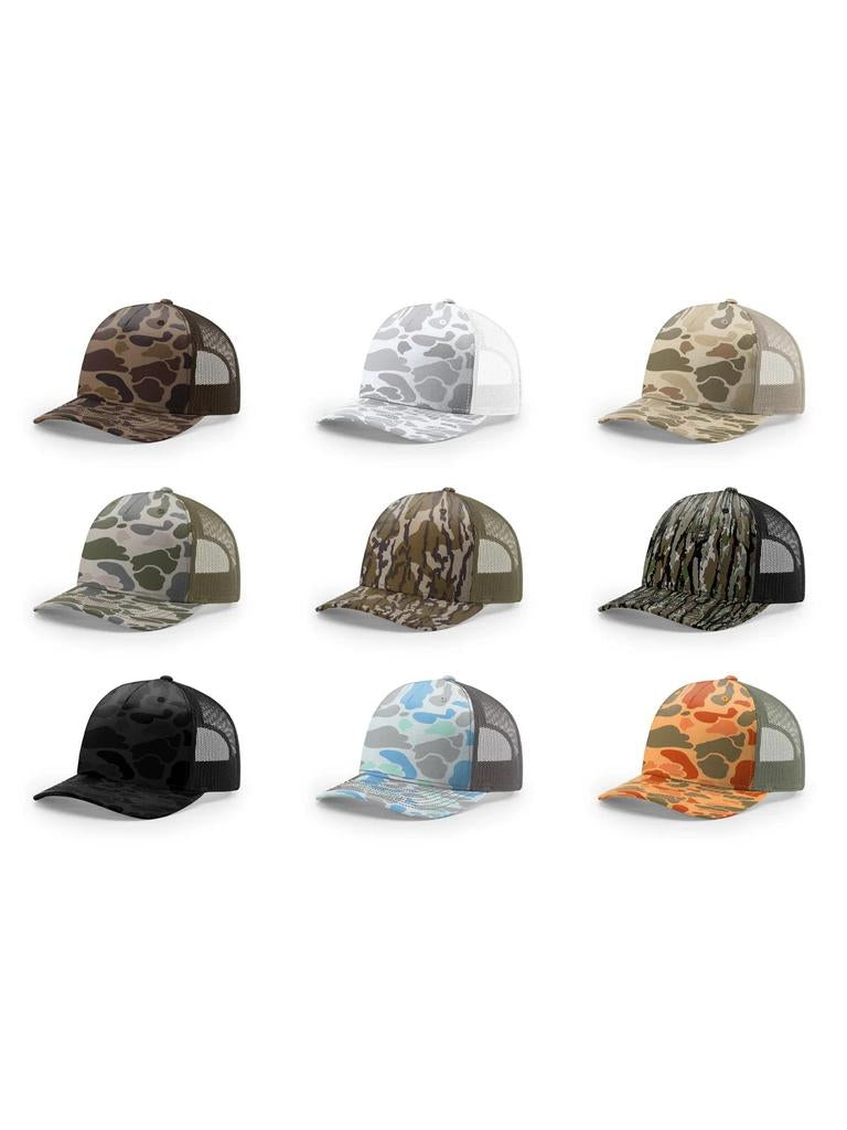 Duck camo Richardson 112 PFP trucker hat with mesh back and adjustable strap.