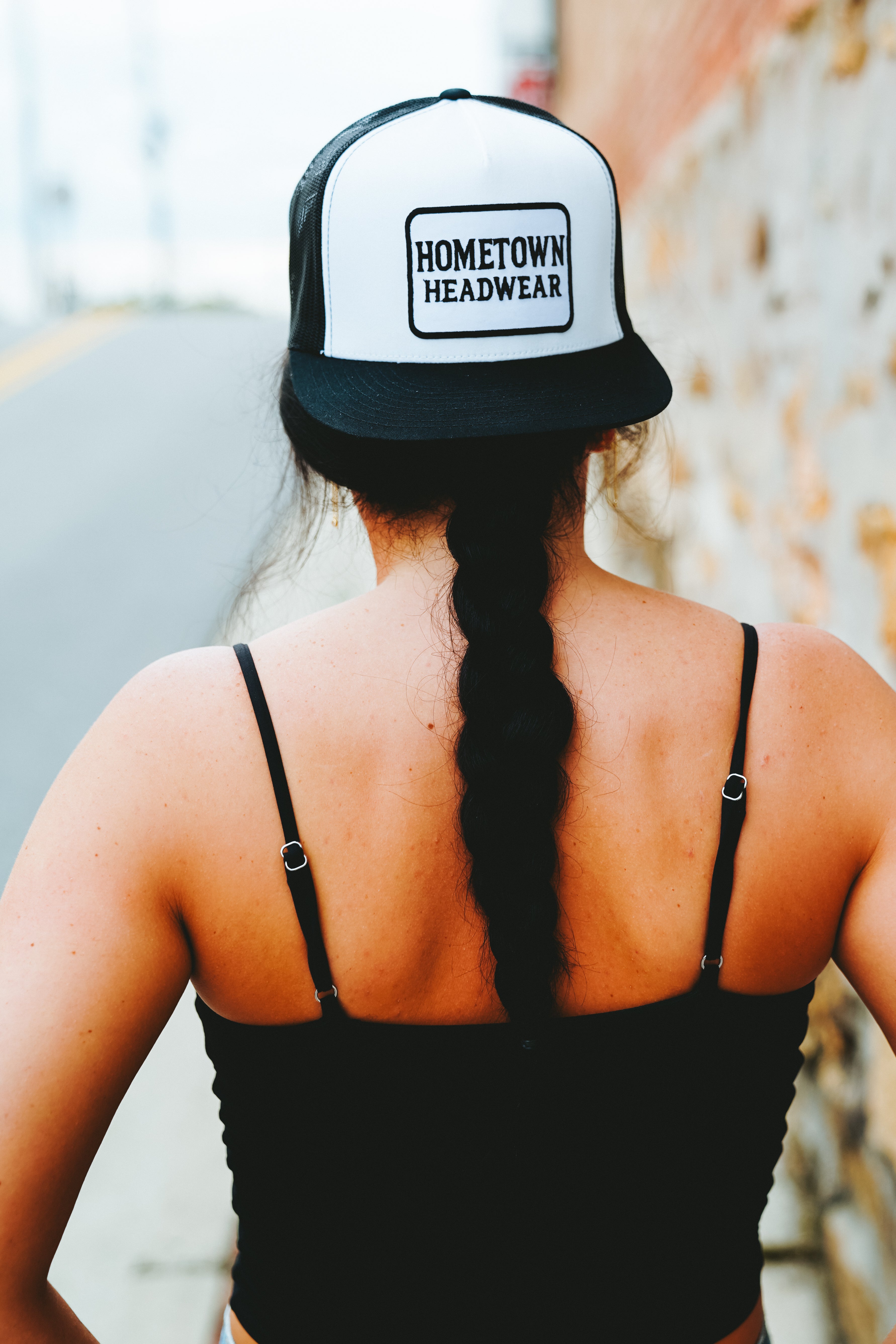 Black & White Trucker Hat with Rectangular Hometown Headwear Patch, rear view.