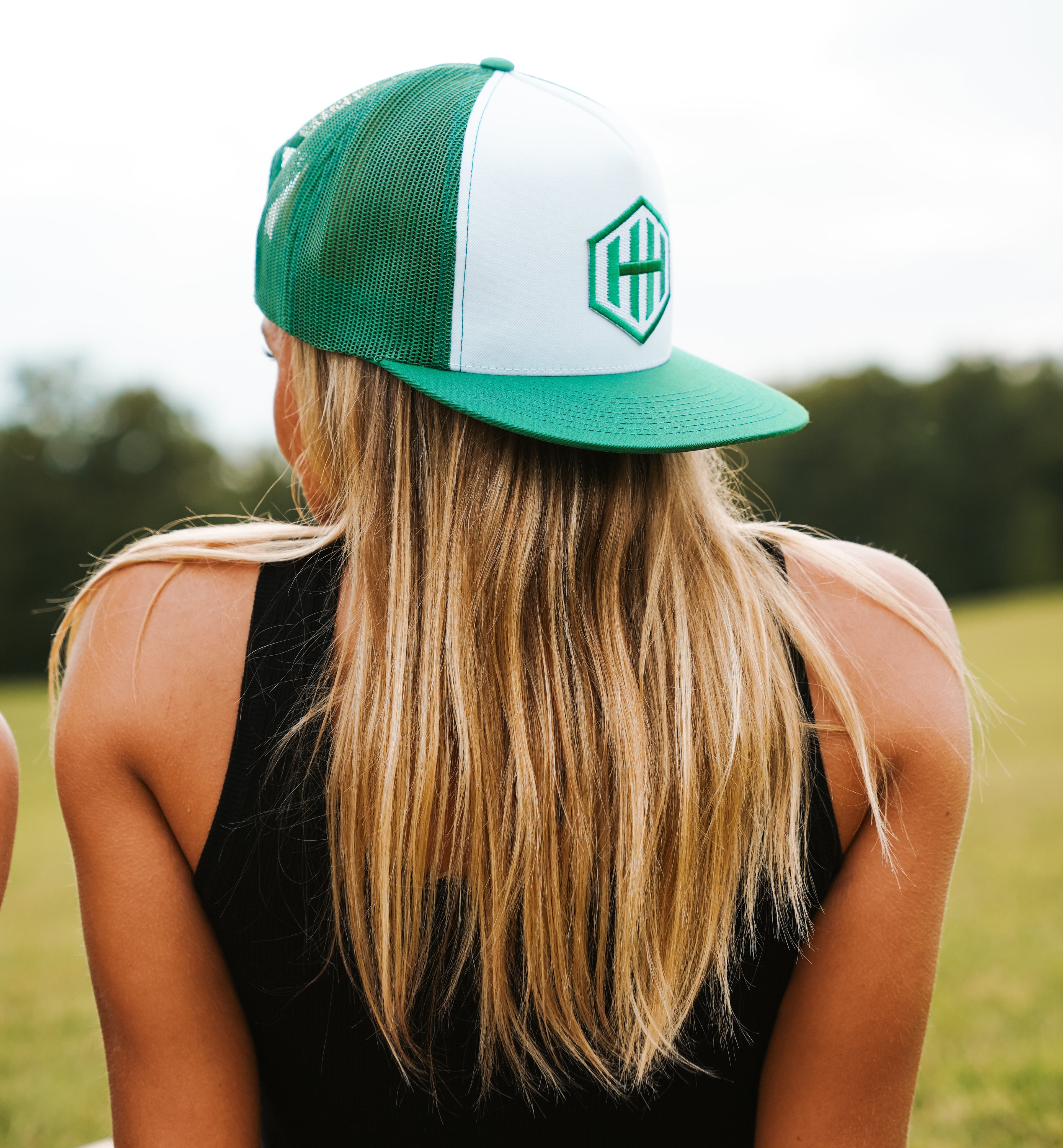 Green & White Trucker Hat with HH Hex Logo by Hometown Headwear.