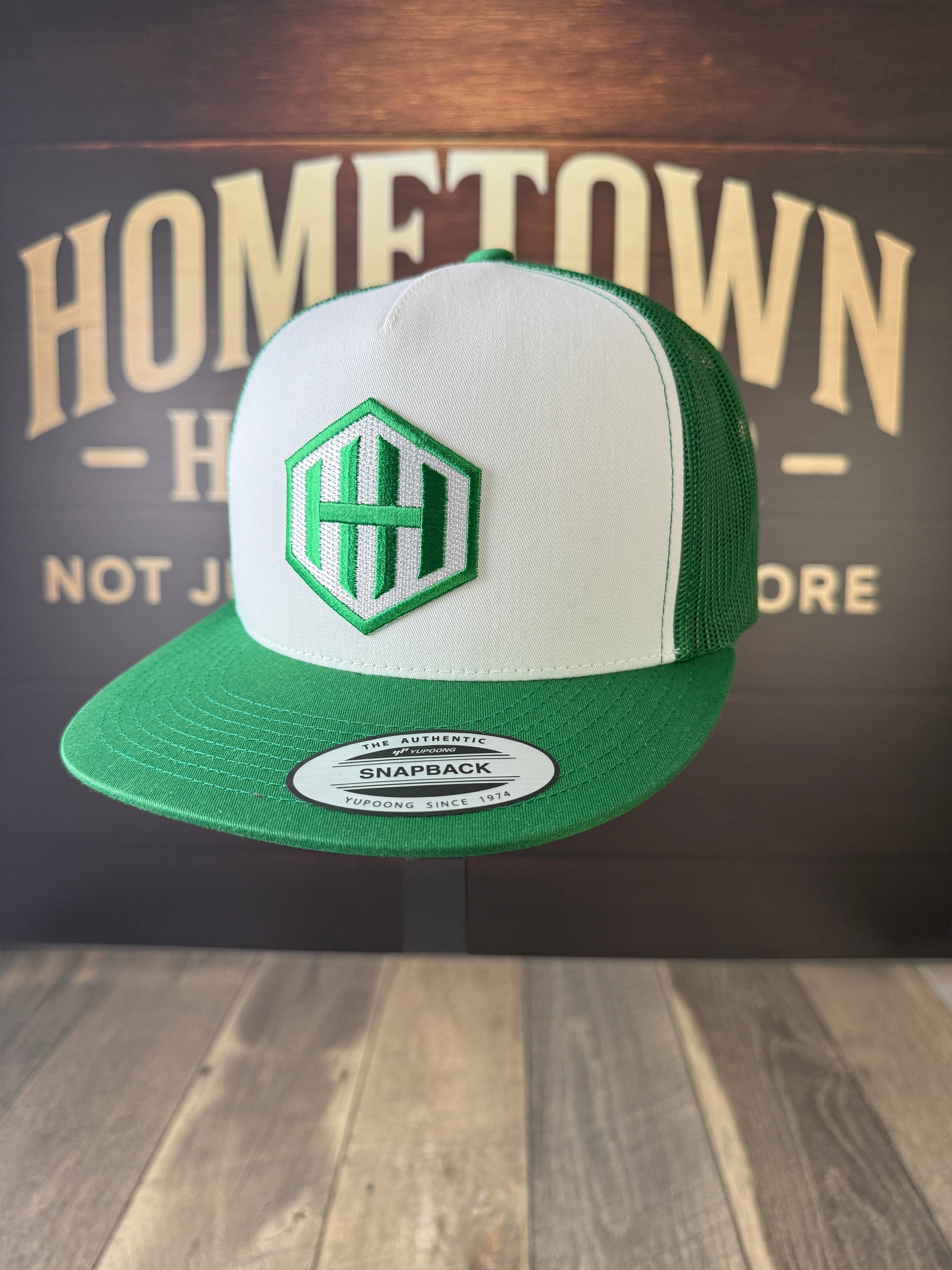Green & White Trucker Hat with HH Hex Logo from Hometown Headwear.