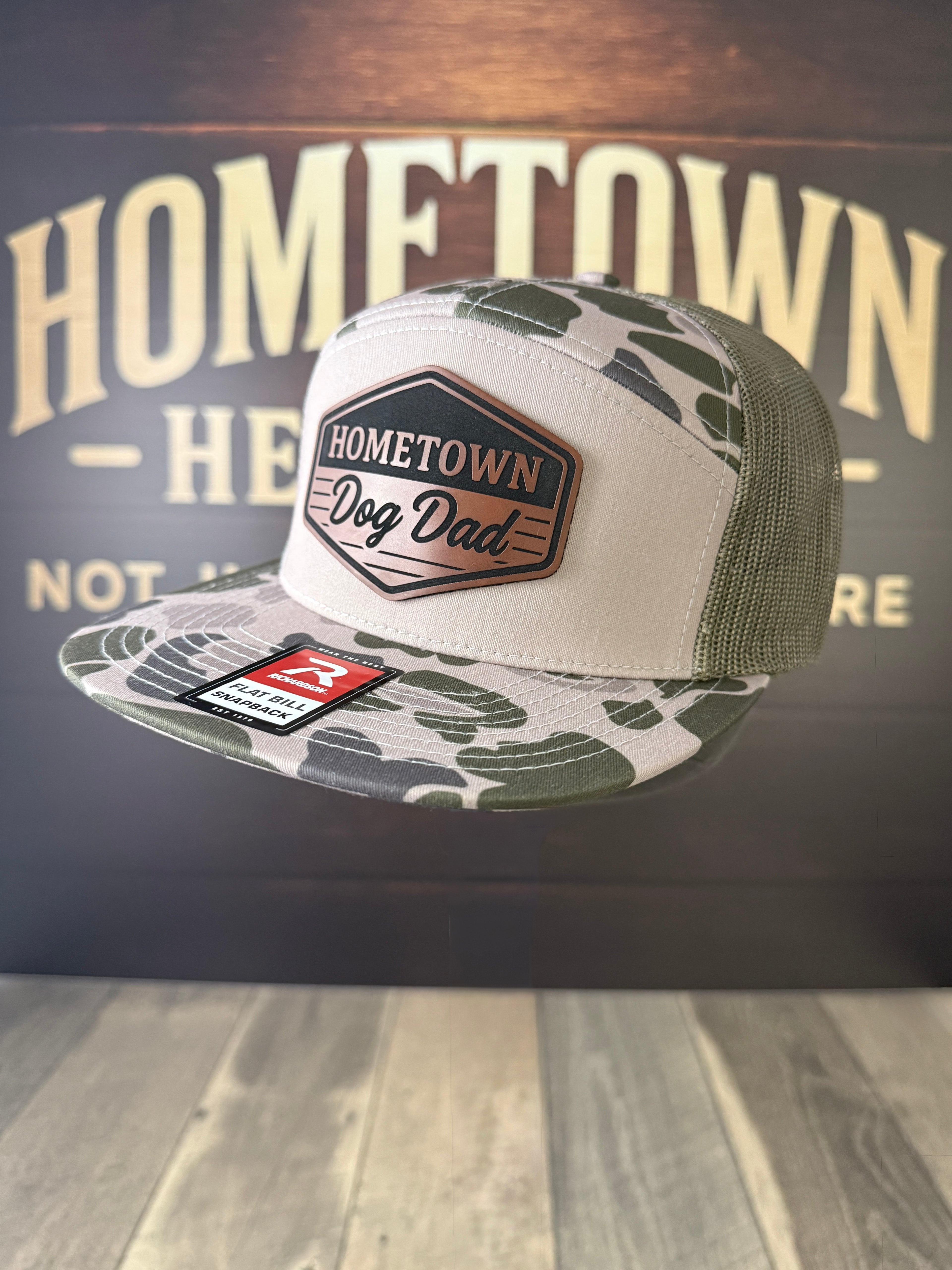 Camo green trucker hat with "Dog Dad" leather patch, Signature Leatherette.