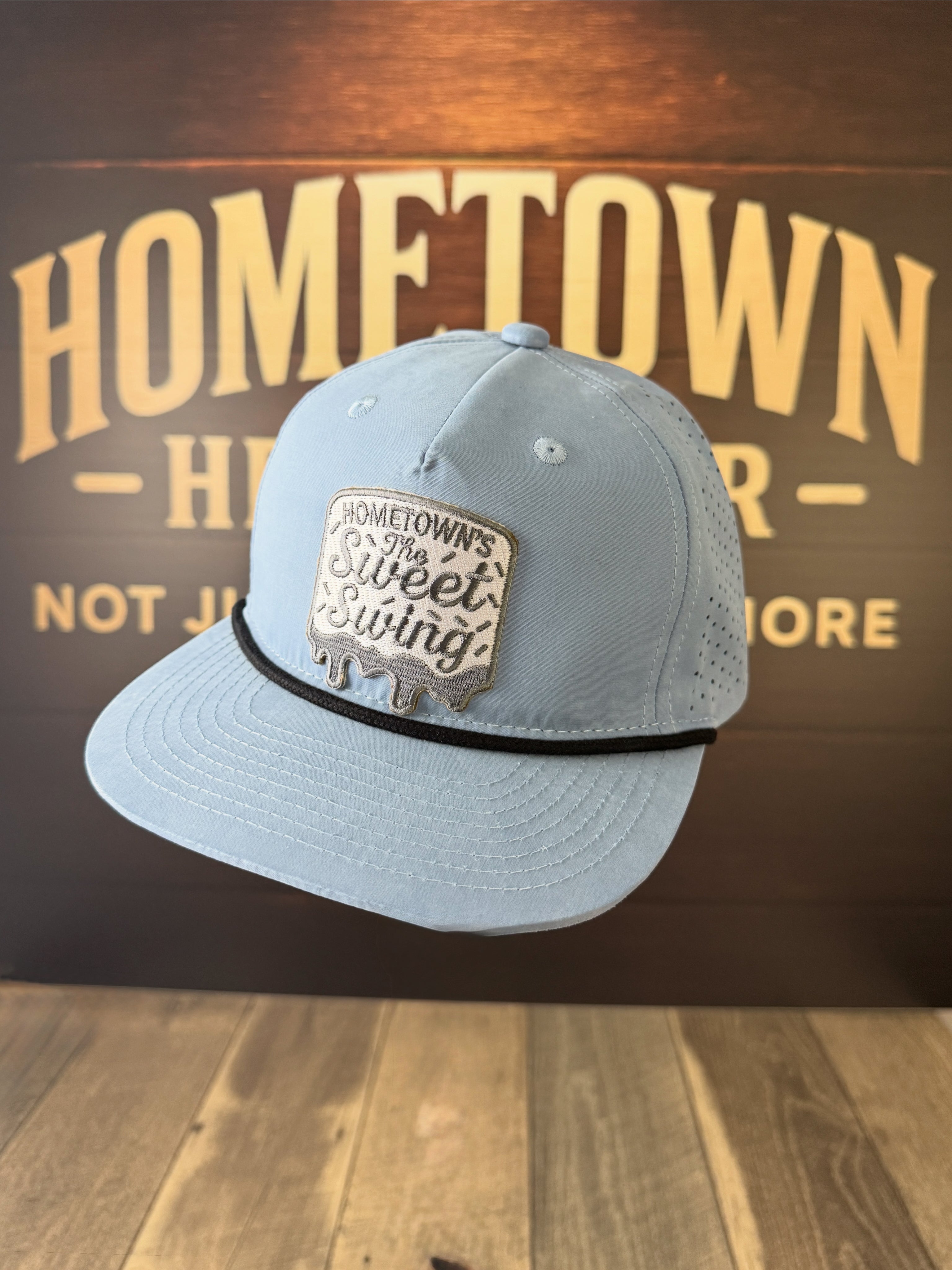 Light blue performance hat with Sweet Swing patch, Richardson & Trucker styles.