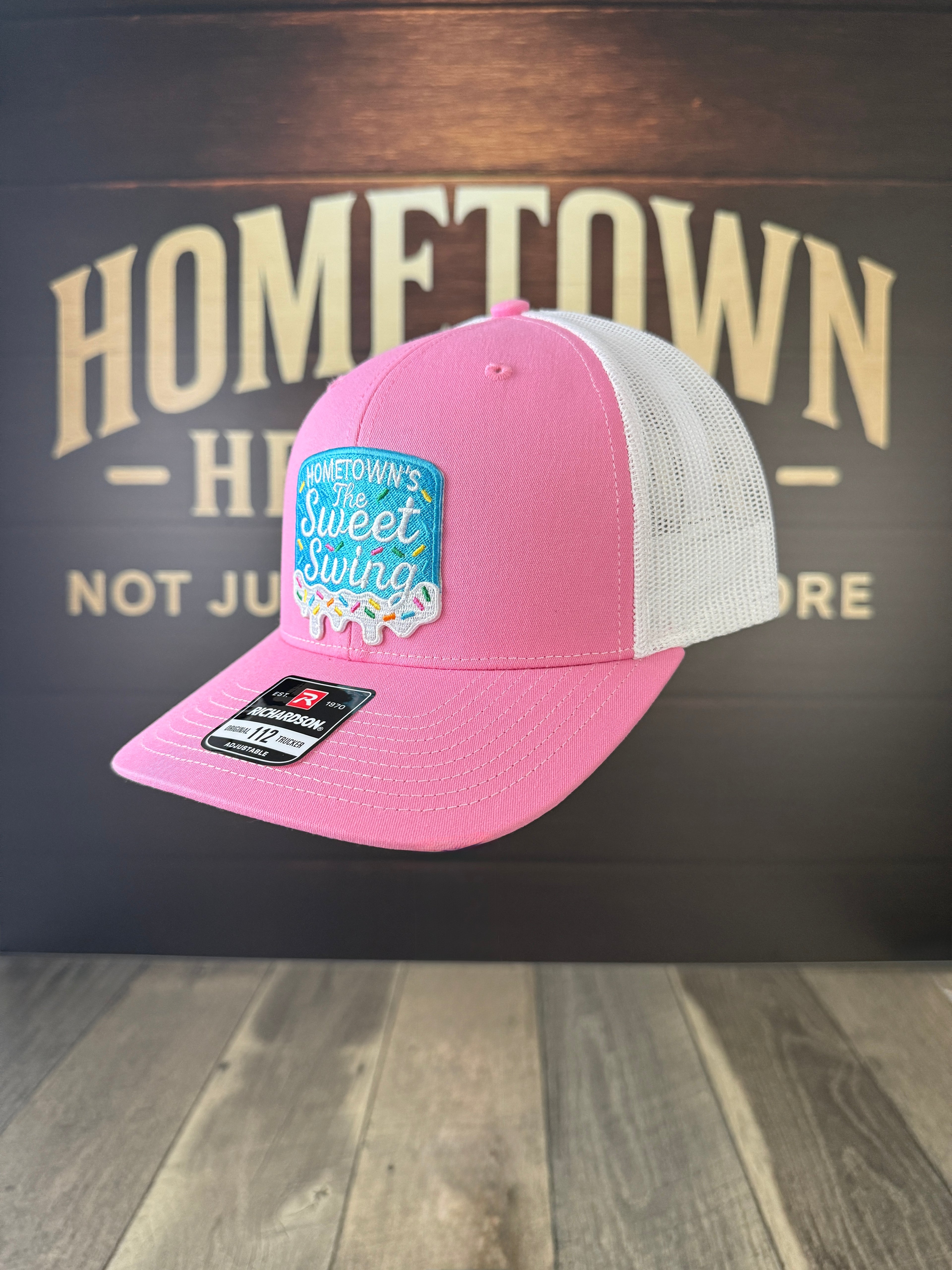 Pink and white trucker hat with Sweet Swing custom patch by The Hometown Co.