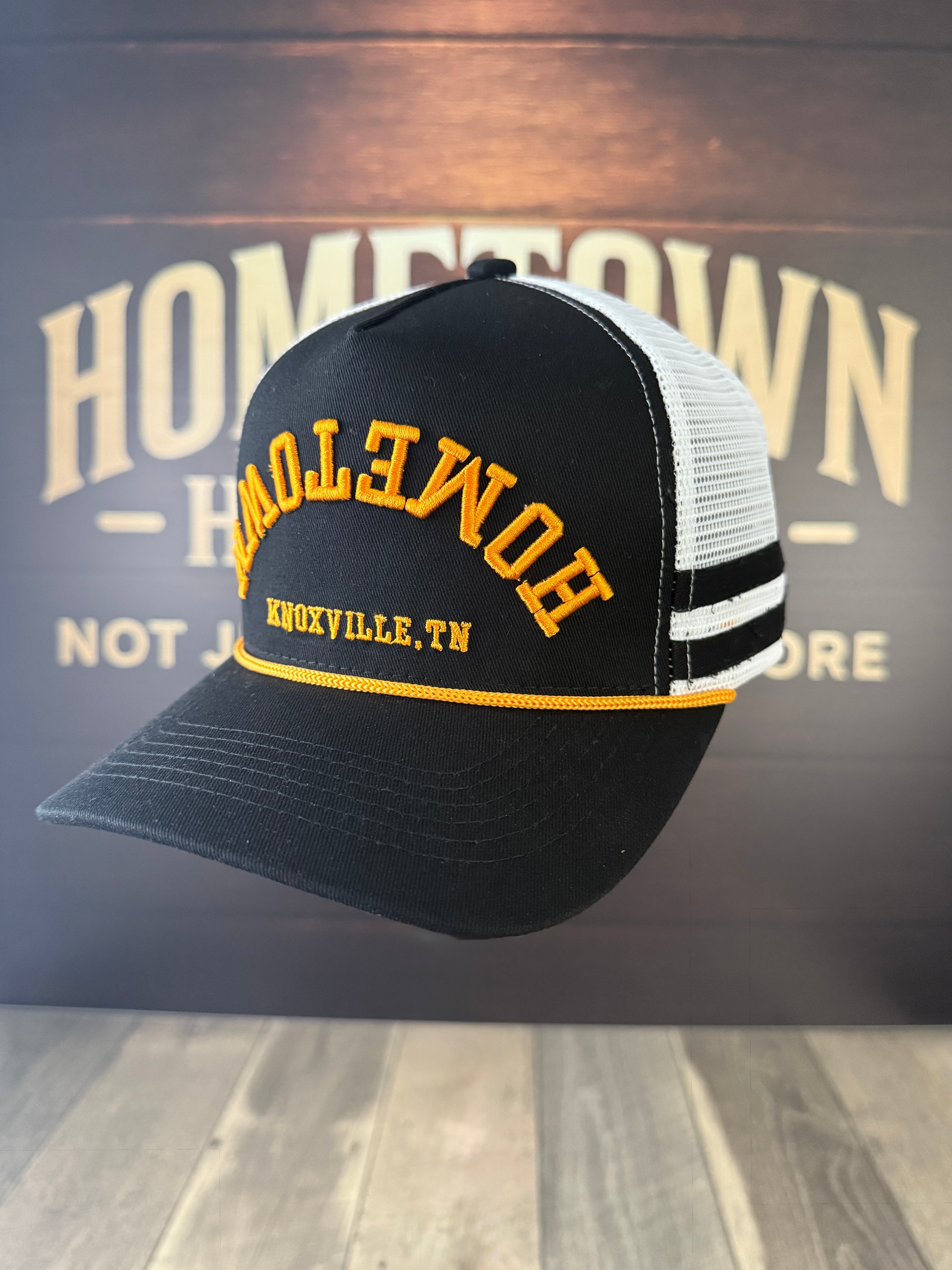 Black Knoxville hat with white mesh and upside down hometown text.